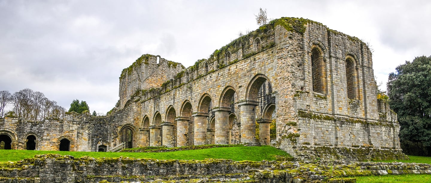 A view of the stone remains and archways of Buildwas Abbey. 