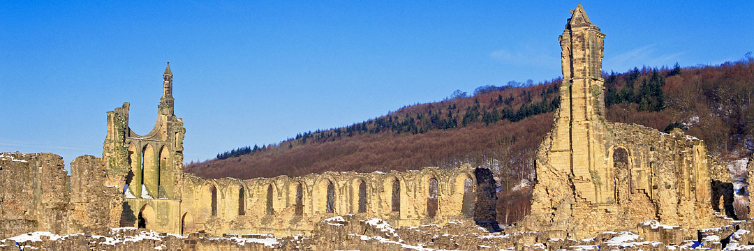 View of the abbey ruins under a dusting of snow