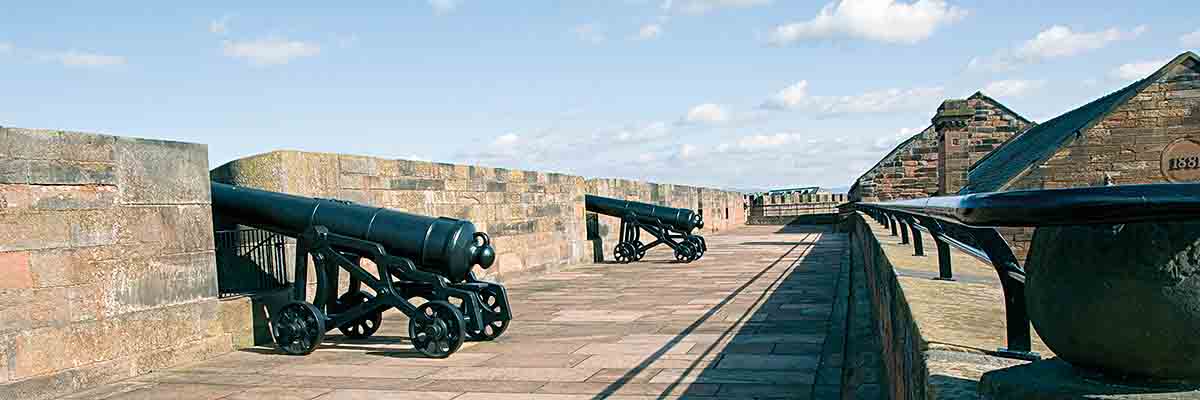 The walkway has cannons along the side of the wall facing away from the Castle. The cannons were 24 pounders