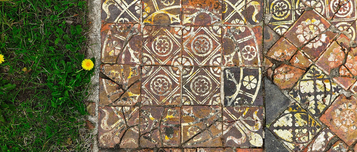 A close up of intricately decorated tiles at Cleeve Abbey