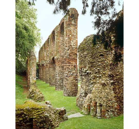 Norman arches along the north aisle rise from a green lawn Norman arches along the north aisle rise from a green lawn