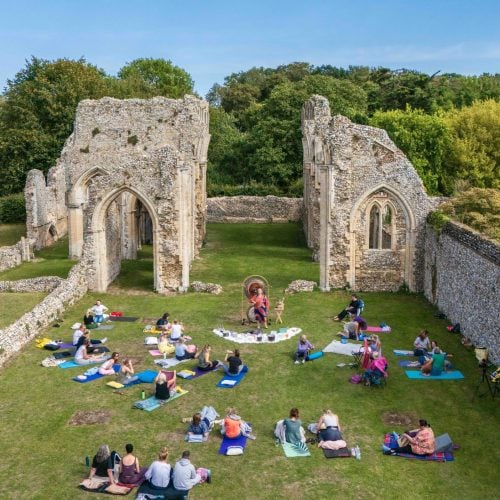 A wide shot of Creake Abbey showing a Sound Bath taking place