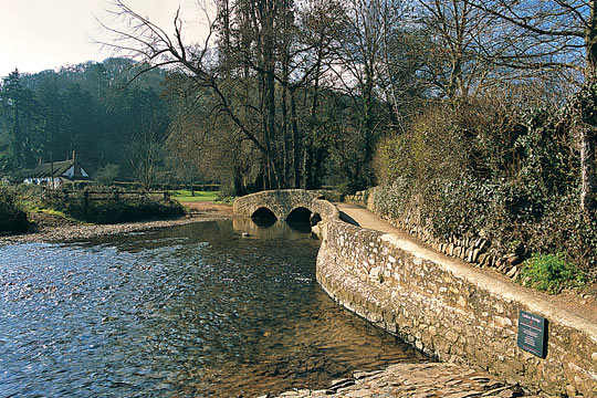 Approach road to the Gallox Bridge with cottage beyond