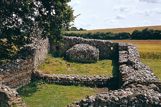 The east end of the medieval chapel, which made use of the surviving Roman walls (identified by alternating layers of grey stone and red tile)