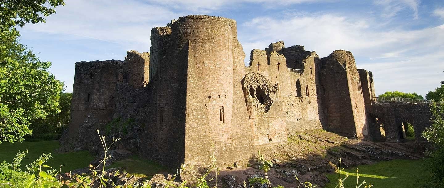 Goodrich Castle viewed from the south, with the south-east tower on the left and gatehouse and entrance causeway on the right