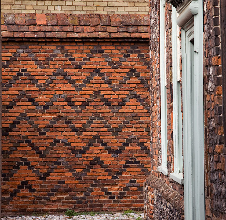 Row 111 House entrance front and yard wall