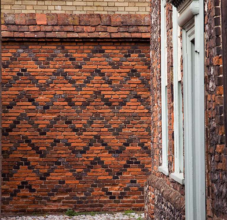 Row 111 House entrance front and yard wall Row 111 House entrance front and yard wall