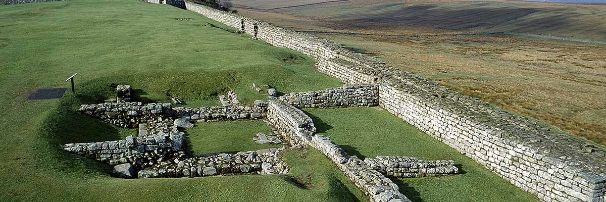 View along the north wall of Housesteads Fort, showing the foundations of turret 36b partially overlain by later walls View along the north wall of Housesteads Fort, showing the foundations of turret 36b partially overlain by later walls