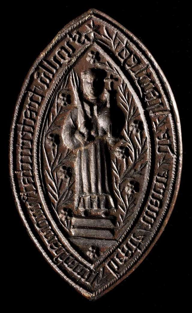 High definition image of seal matrix showing a figure holding an orb with a cross on top
