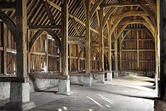 Interior of Harmondsworth Barn looking north-west, the impressive timber structure towering above