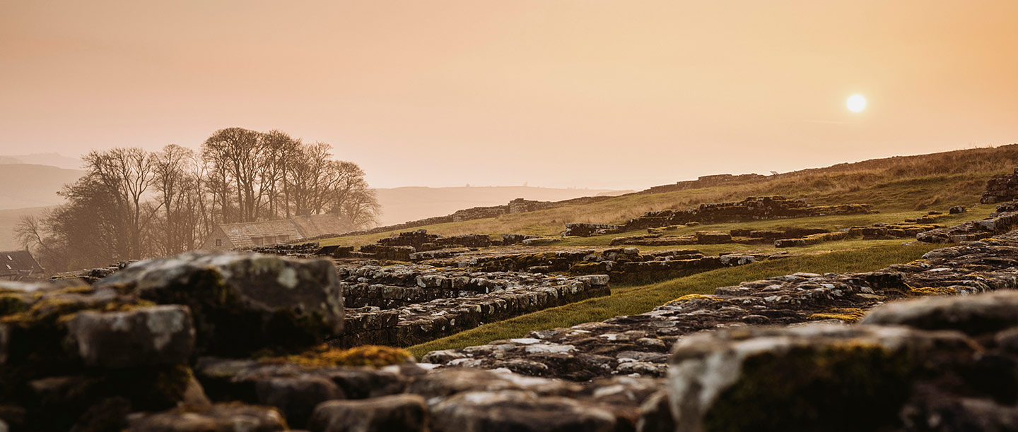 A low ancient wall and building ruins