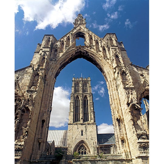 View of St Peter's Church through the east window of the ruined chancel