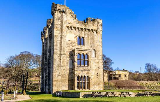 A castle tower with large glazed windows A castle tower with large glazed windows