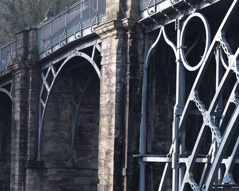 A close up of the iron work and stone abutments 