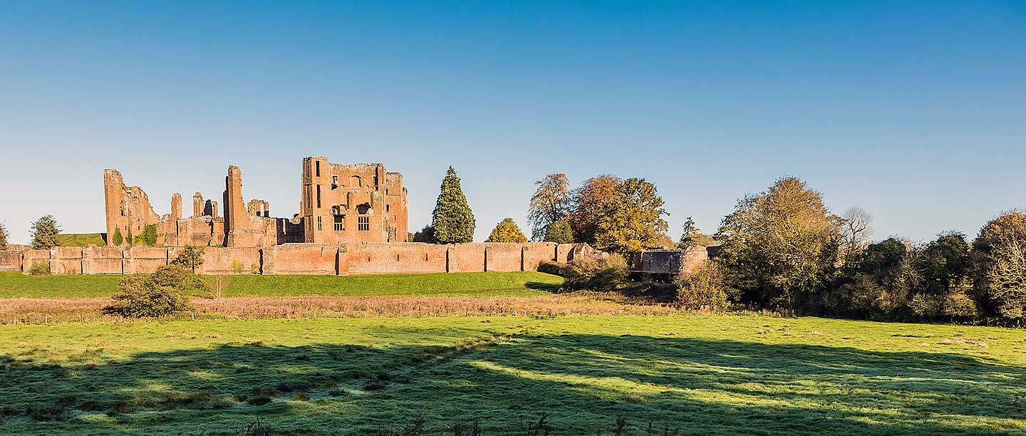 Kenilworth Castle seen from across the mere