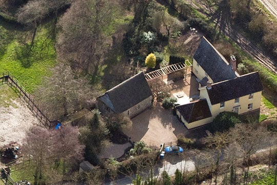 Aerial view of St James's chapel, with neighbouring cottage