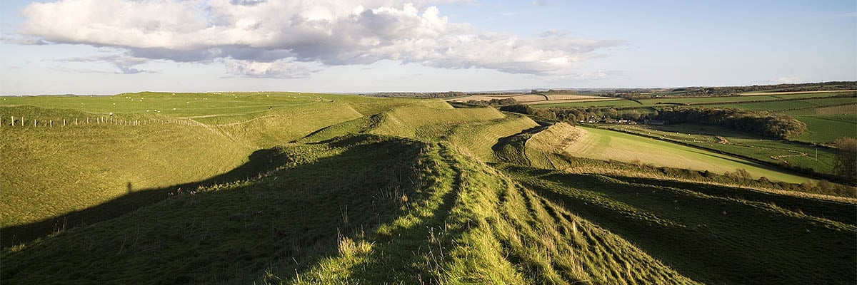 A view along the ramparts of Maiden Castle A view along the ramparts of Maiden Castle