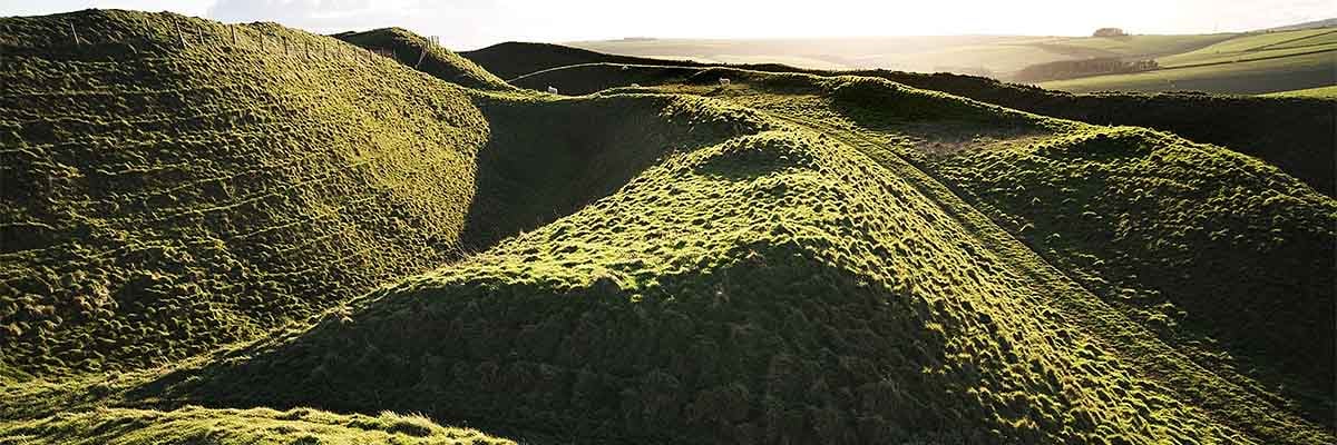 The west entrance and ramparts at Maiden Castle The west entrance and ramparts at Maiden Castle