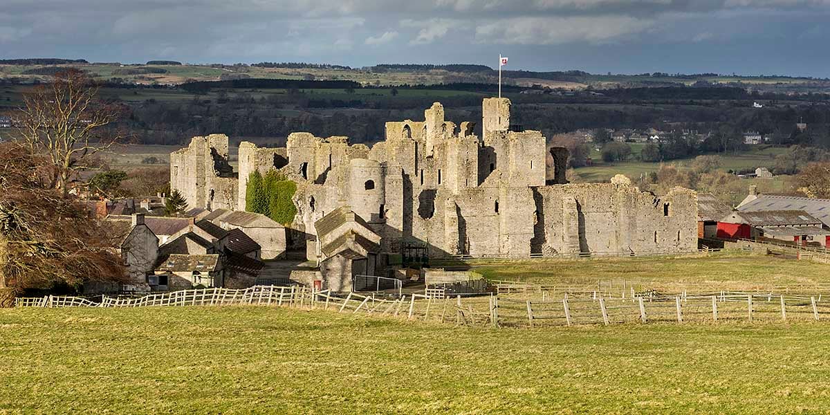 Middleham Castle seen from the fields to the south-west, where its gardens used to be in the Middle Ages Middleham Castle seen from the fields to the south-west, where its gardens used to be in the Middle Ages