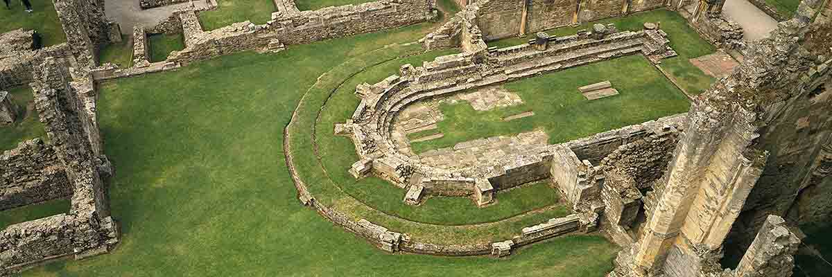 Aerial view of the remains of the chapter house at Rievaulx Abbey – its unusual rounded east end makes it one of the most remarkable buildings from Abbot Aelred’s rule