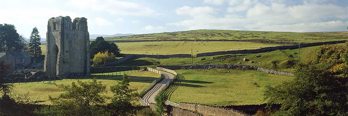 The west tower of the church (left) of Shap Abbey and the Lowther valley