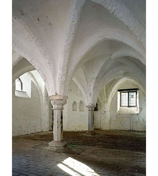 The undercroft with its fine brick vaulting painted white