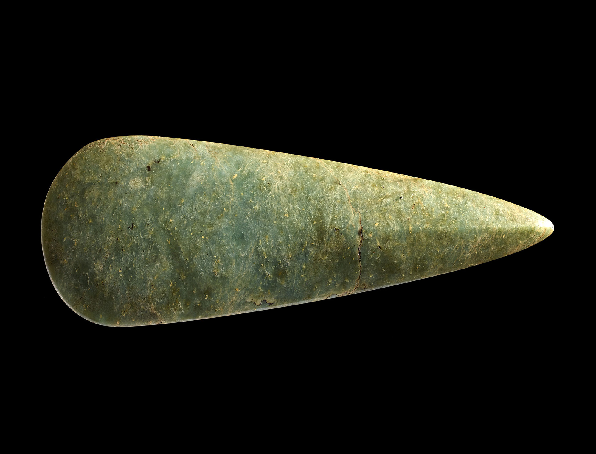 Polishing this jade stone axe for hundreds of hours gave it an intense shine and emphasised its green colour, making it highly prized