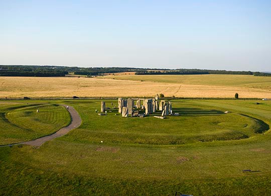 Low-level aerial photograph of Stonehenge showing the earlier circular earthwork around the stone monument