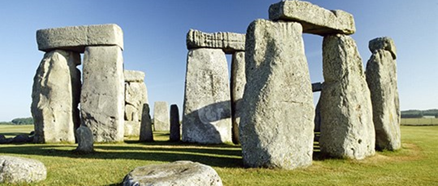 Stonehenge in the daytime against blue sky