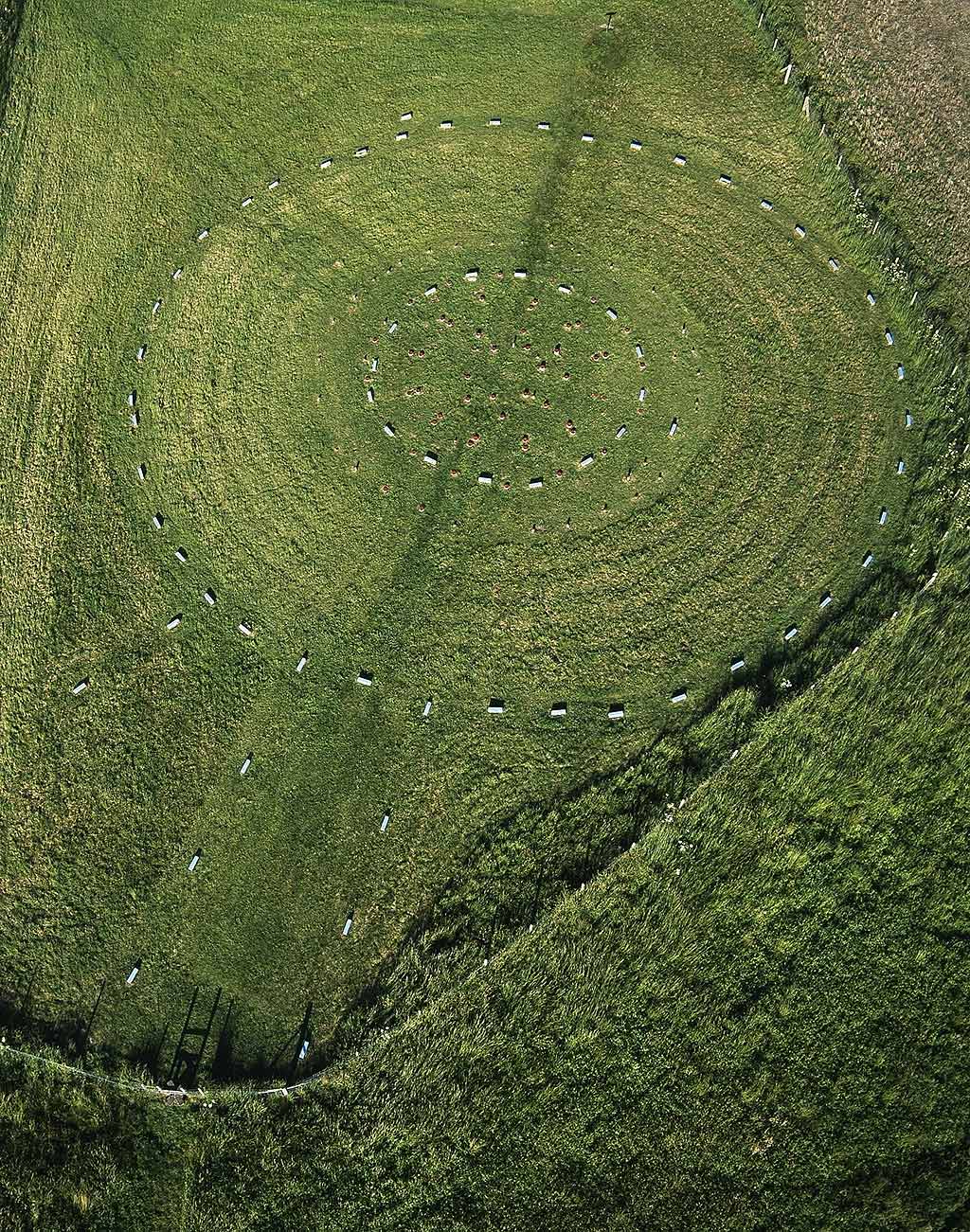 An aerial photograph of the site. The concrete blue and red blocks mark the positions of the stoneholes and postholes respectively