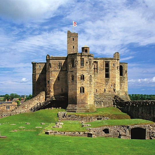 The very impressive and substantially intact remains of the great tower seen from across the bailey at Warkworth Castle and Hermitage