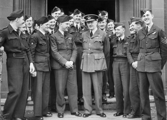 Informal portrait of Sir Arthur Harris with members of No.460 Squadron RAAF, September 1943