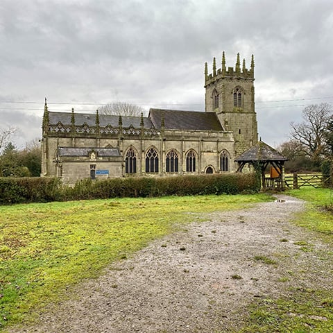 A path leads up to a church (St Mary Magdalene's Church, Battlefield)