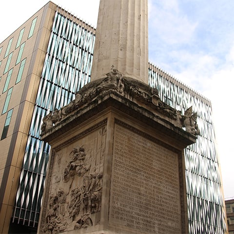A close up of the plinth of the monument to the Great Fire of London