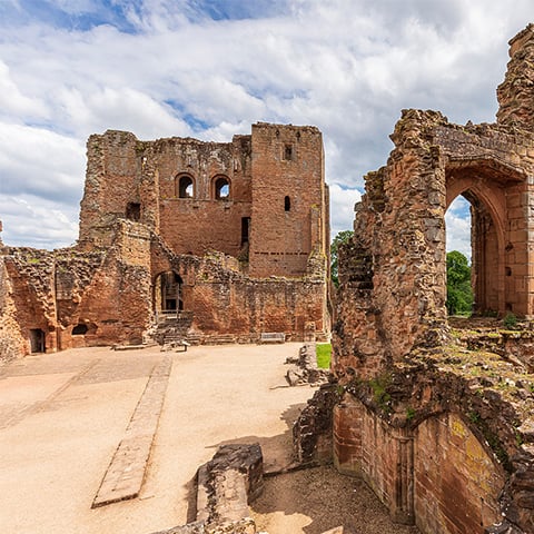 A view of the medieval ruins at Kenilworth Castle, including the walls of the Great Hall and the kitchens.