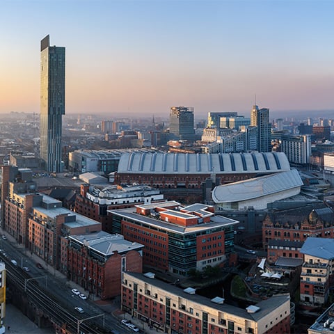 A view of the Manchester city scape at sunrise.