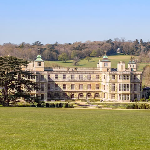 A view of Audley End from a far on a sunny day.