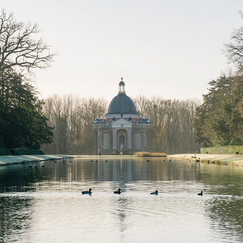 The pavilion at Wrest Park with the large pond and ducks in the foreground.