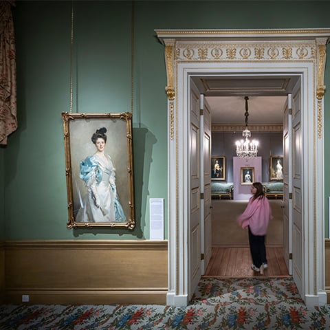 a young woman walks through a doorway which is next to a portrait (Mary Crowninshield Endicott Chamberlain by John Singer Sargent)