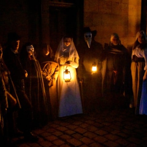 Spooky photo of people in ghostly costumes