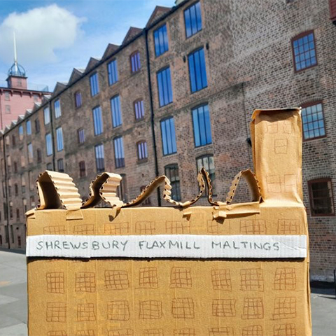 Image: Cardboard model of Shrewsbury Flaxmill Maltings in front of the actual building