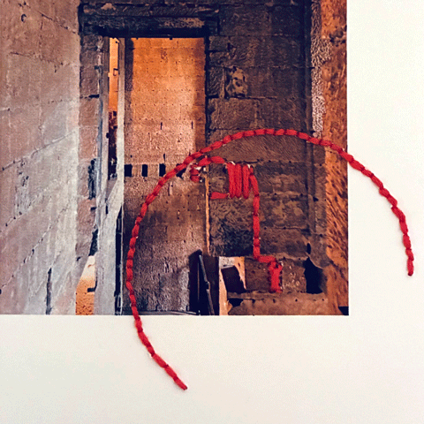 An abstract edited photo of a stone building with a red semi-circle overlaying the image.