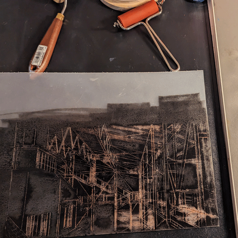 An abstract architectural drawing on a desk.
