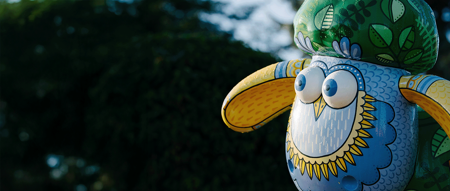 Close-up photo of a colourful patterned Shaun the Sheep statue at Wrest Park in Bedfordshire