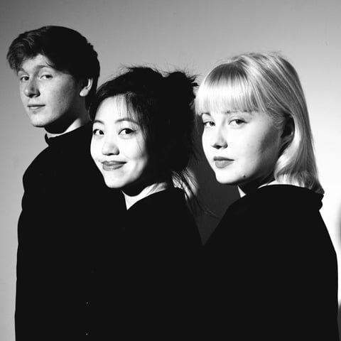 A black and white photograph of The Paddington Trio, made up of three performers.
