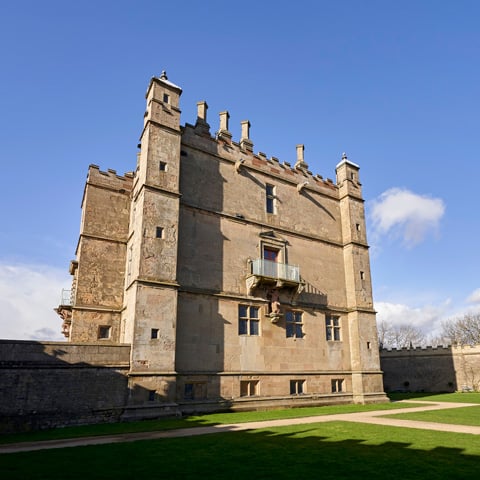 An exterior view of the little castle building at Bolsover Castle on a sunny day.