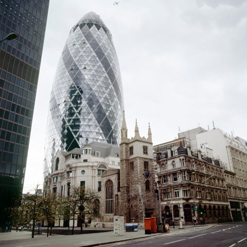 A low angle view of the Gherkin tower in London.