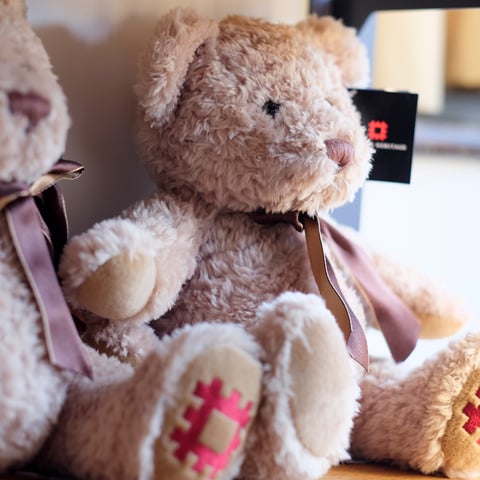 Two English Heritage branded teddy bears.