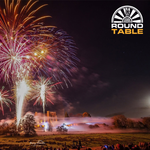 A digital illustration of a firework display above Kenilworth Castle.